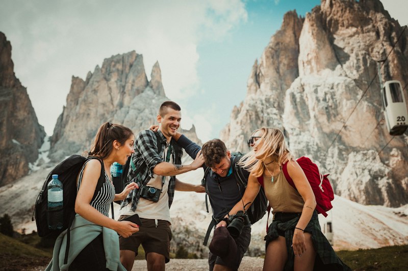 Friends laughing on a small group travel hiking adventure