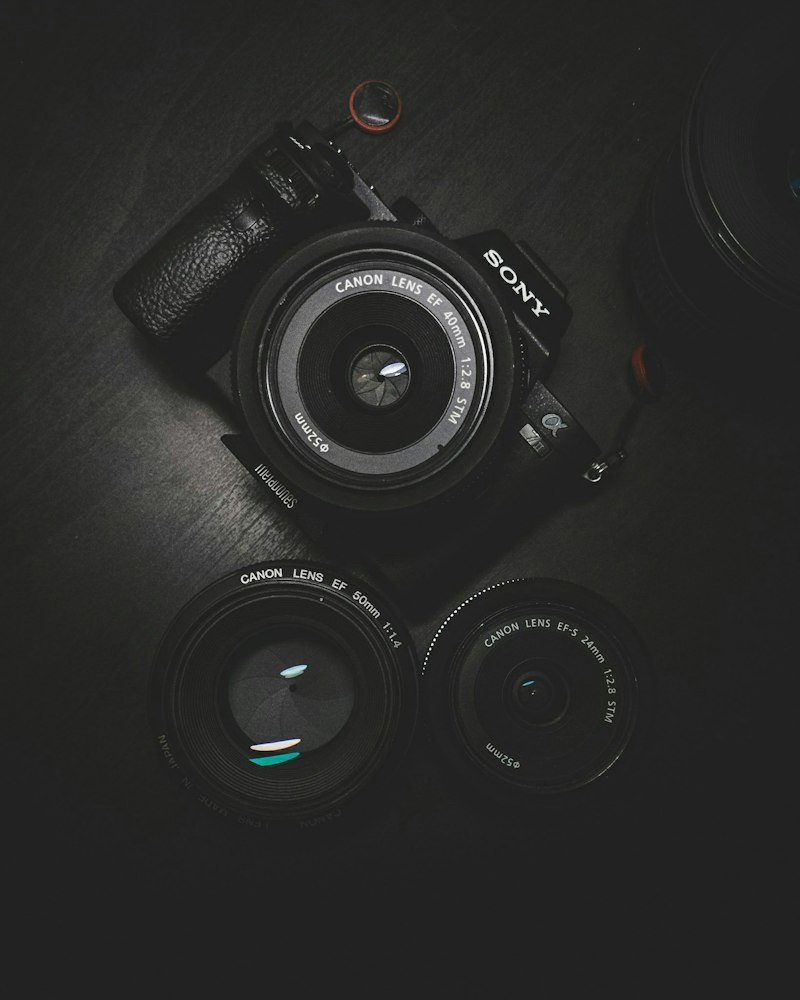 Smartphone and camera devices on a travel desk