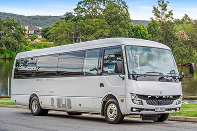 Mid-size 21 to 24 seater mini coach Toyota Coaster Mitsubishi Rosa group charter